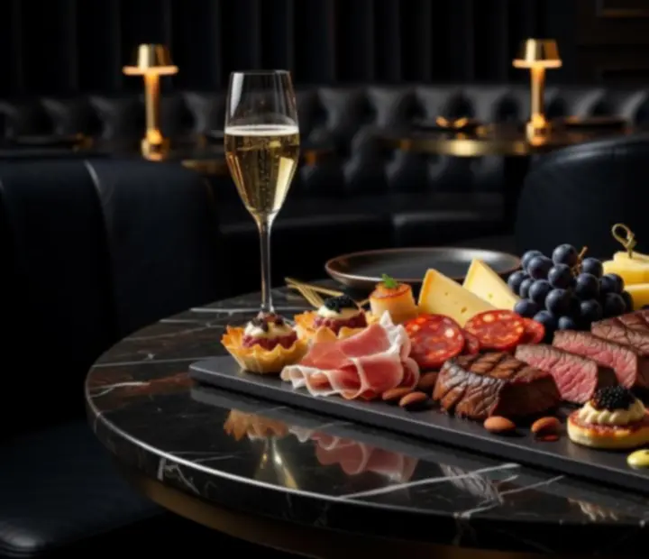 Gourmet shareable platters arranged for late-night dining in the lounge